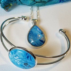 Hand-painted silver/blue necklace, bracelet set with Coralline Jewelry pouch.